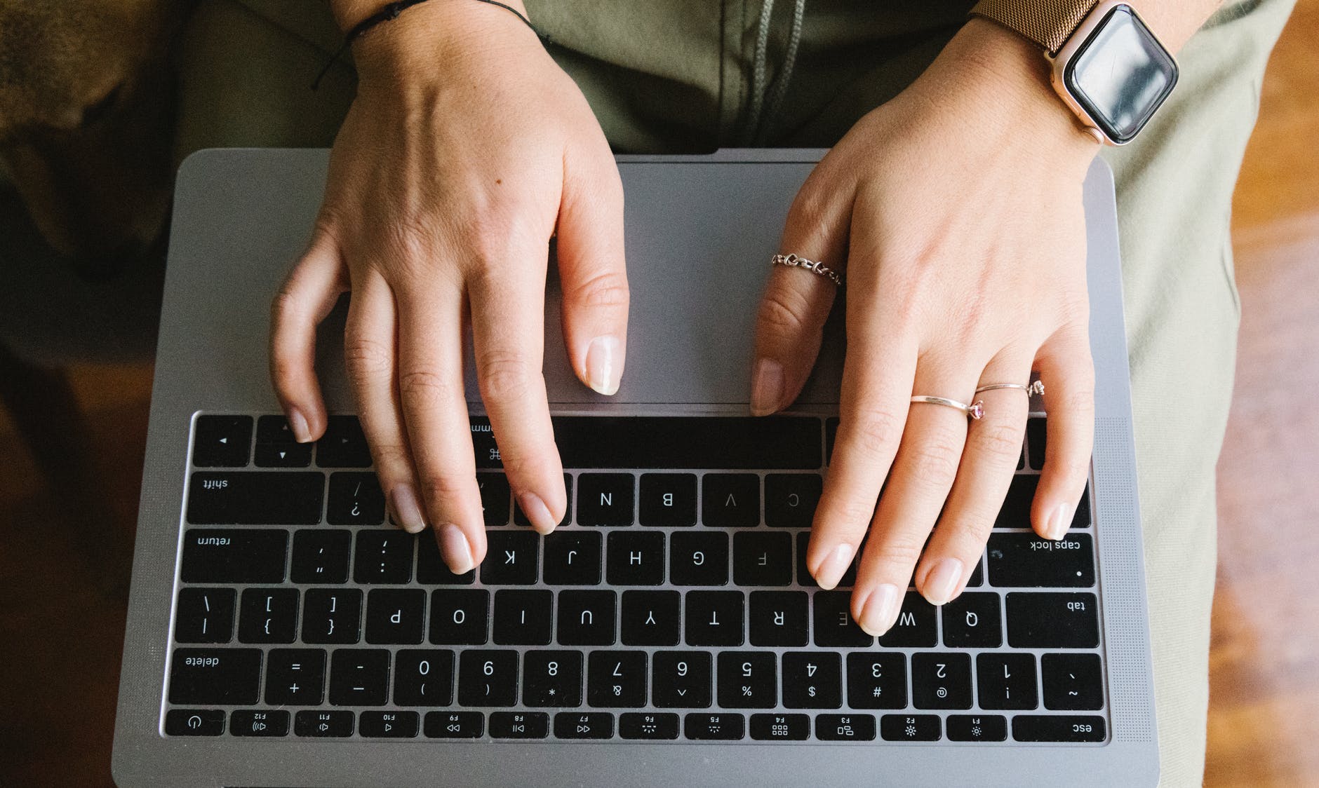 crop unrecognizable woman working on laptop